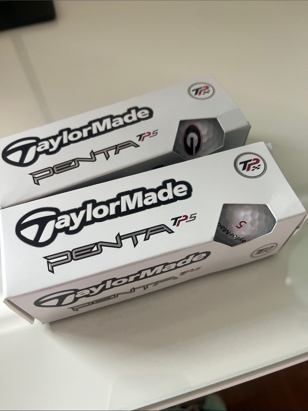 TaylorMade White Golf Ball with Black & Red Logo Accents